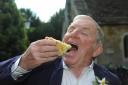 John Potter who coordinated the Jubilee tea party enjoys a slice of Victoria Sponge. Photos: Trevor Porter