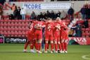 Swindon players in a huddle