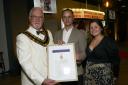 Trowbridge Mayor Cllr Stephen Cooper presents Craig and Kerry Stone, of Stone Developments, with the Town Enhancement Award.