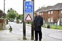 Former councillor Jamie Cullen next to the sign for the Westleigh Home Zone Photo: Diane Vose