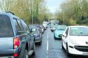 Long delays hit the roads as motorists struggled to beat the floods