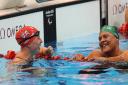 Stephanie Millward (left) is in to her fifth final after qualifying from her SM9 200m individual medley heat behind Natalie du Toit (right)