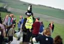 2014 Wiltshire Chief Constable trys on a hat at the Avebury Summer Solstice Photo  Diane Vose.