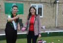 Chris Poole, a qualified bowls coach, teaches MP Michelle Donelan the art of playing bowls Photo: Trevor Porter 67570-1