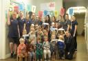 Children and staff at Busy Bees Day Nursery in Trowbridge celebrate their third 'Outstanding' rating from Ofsted.