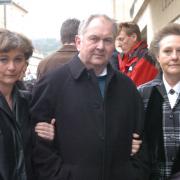 Dominique, left, with Steve and Pat Hall in 2004