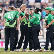 Southern Brave's Lauren Bell (centre) celebrates with team-mates after taking the wicket of Oval Invincibles' Mady Villiers during The Hundred match at The Ageas Bowl, Southampton. Picture date: Monday August 16, 2021..