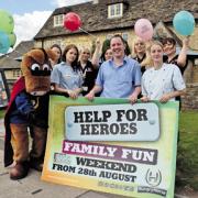 West Inn manager Tim Jones, assistant manager Jo Fox, left, and chef Erin Rugg with the Hungry Horse mascot and staff ahead of the Bank Holiday weekend fundraiser
