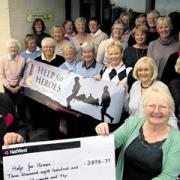 Captain Sylvia Booth and the ladies of Kingsdown Golf Club present a cheque for £3,878 to West Wilts Help for Heroes co-ordinator David Bartholemew