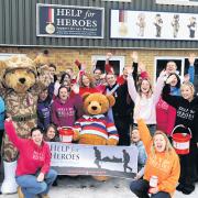 Charity founders Bryn and Emma Parry celebrate the Wiltshire Times’ success with helpers