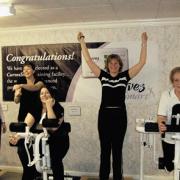 Pauline Cox, centre, celebrates being the biggest weight-loser in a fundraiser for Help For Heroes at Curves, Chippenham