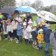 Lions Easter Egg hunt and Bonnet Competition
 Brolly good show Youngsters with the array of Bonnets brave the heavy rain.
 Photo Trevor Porter  69753 1