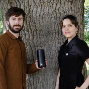 Aaron Oxenham with his partner Mariana Cardenas and their new portable speaker made from ocean waste plastics.