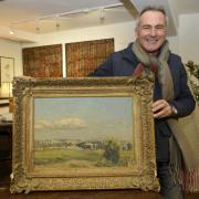 Paul Martin with the Avon Valley painting at his Corsham store