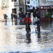 Some people used pedal power to get through the floods in Bradford on Avon