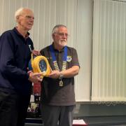 Trowbridge Lions Club joint president Richard Culverhouse (right) presents the defibrillator to Bob Brice (left), vice-chair of Studley Green Community Centre.