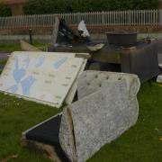 It costs between £75.60 and £151.20 to remove a dumped settee depending on whether it is a 2,3 or 4-seater. This one was left at Lambrok Road in Trowbridge.