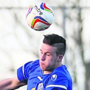 Aaron Oakley, pictured playing for Chippenham Town against Frome Town last season, has signed for the Robins
