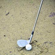 In wet sand, have the clubface square on to the target