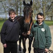 Trainer Neil Mulholland, left, with The Druids Newphew and stable lad James Paget