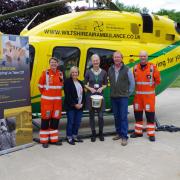 Valerie Whistler, Wiltshire Air Ambulance partnerships co-ordinator with Alison and Jonathan Sinclair, owners of Lowden Garden Centre, and WAA paramedics
