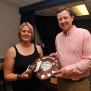 Laura Morgan receives her award for Chippenham & District Sunday League best junior referee from sponsor Martin Webb, of Shoestrings Chargrill. Photo Trevor Porter 59677 3