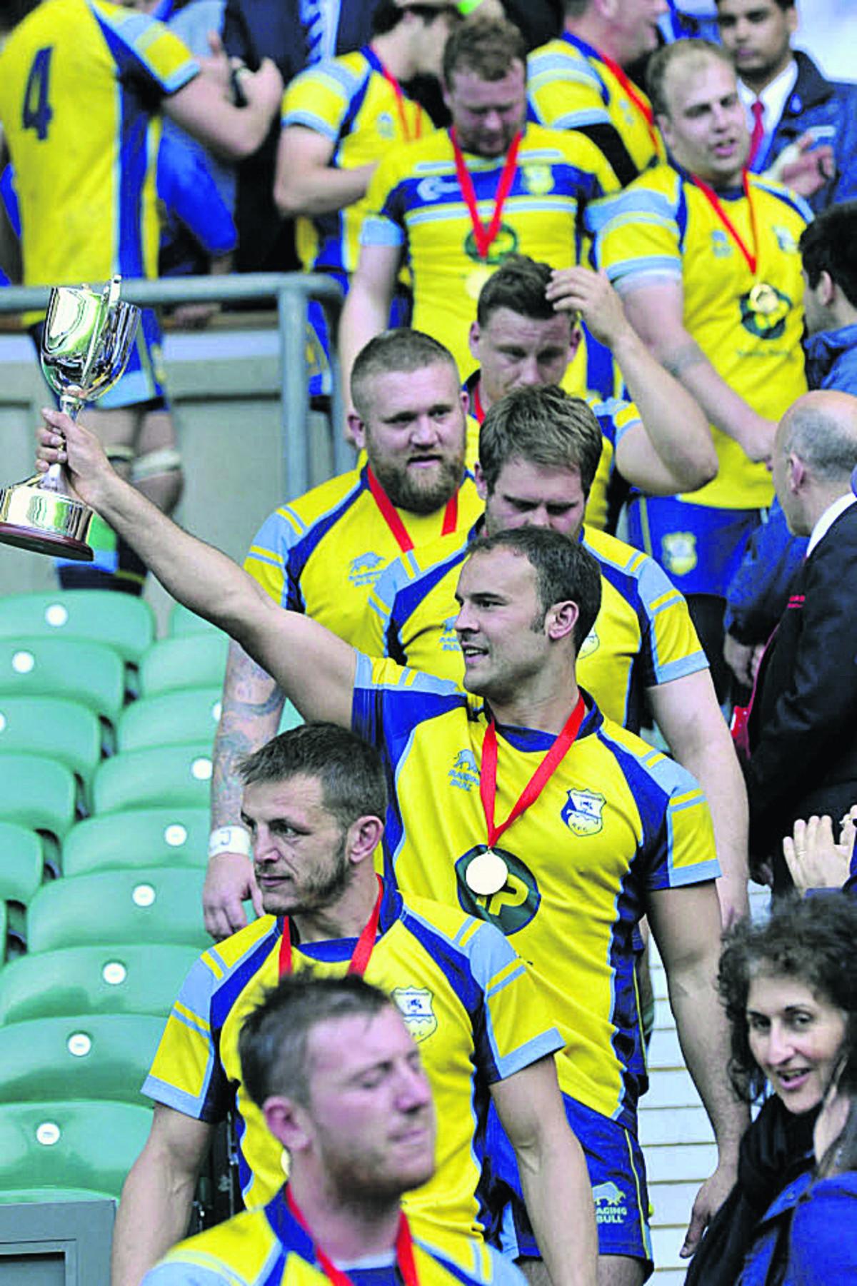 Trowbridge RFC players and fans celebrate victory in the RFU Intermediate Cup match at Twickenham over Leek yesterday.