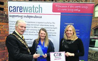 The mayor of Trowbridge John Knight and care manager Jessica Walder, present the award to Rose Scarff, centre