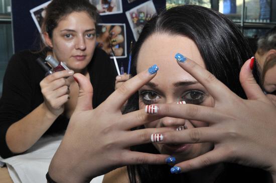 Angel Preece shows off her finished nails painted by Wiltshire College Level 1 student Rebecca Singer