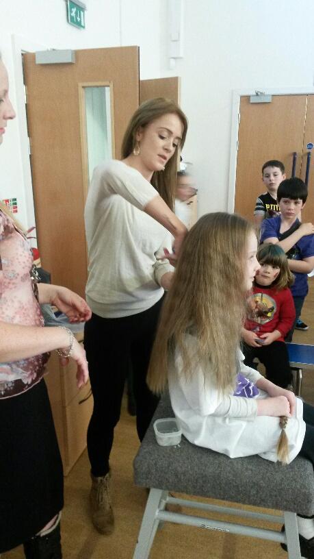 Local hairdresser Charlie Ann Rylands from The Cutting Bar cuts Xandria Gilbert’s hair for Children in Need