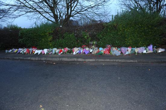 Floral tributes at West Wiltshire Trading Estate, Westbury, to the three young men who died on Friday night. Pictures by Trevor Porter