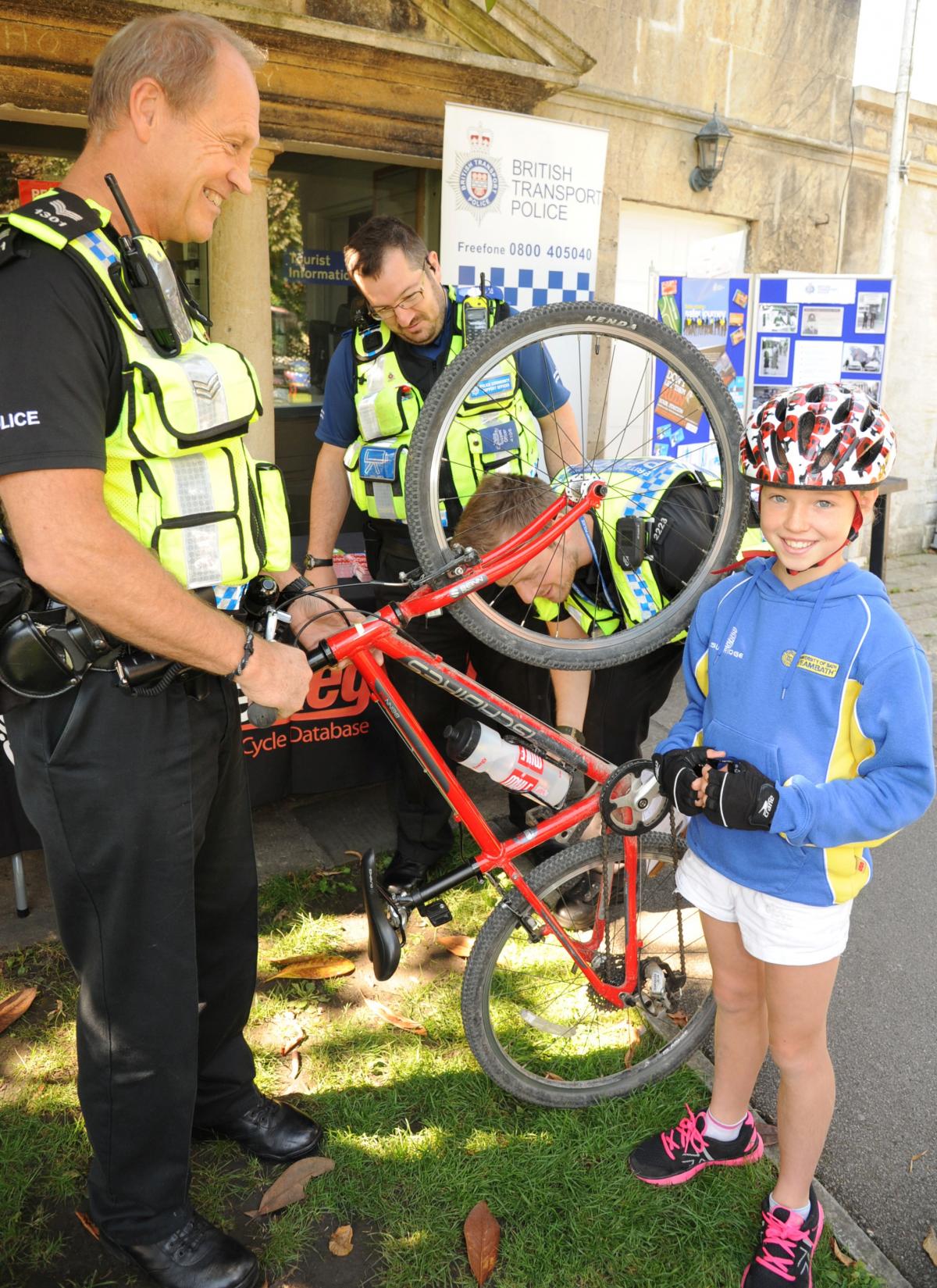 Ellie gets her bike security marked by British Transport Police during Bradford On Avon Cycling Festival. Picture by Trevor Porter