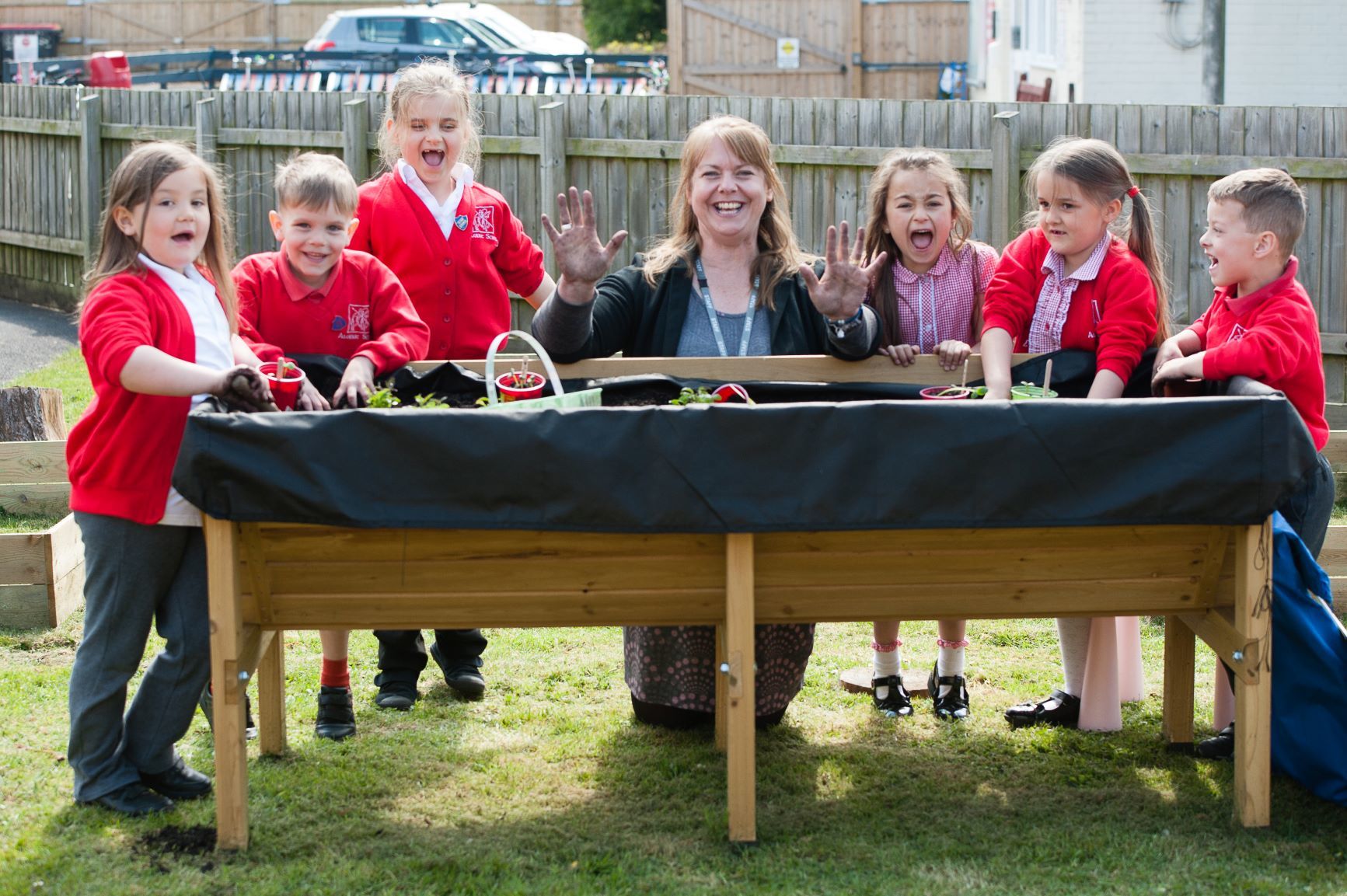 Rebecca Clifton (centre) head teacher of Aloeric Primary School with pupils at the school