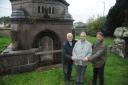 Chairman of Civic Trust Glyn Bridges, left, at the mausoleum. The bronze doors had been stored inside for safekeeping, Chairman of Friends of the Down Cemetery and Cllr Edward Kirk at the Roger Brown mausoleum with replacement wooden doors after the