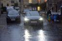 A group of nursery school children managed to escape getting drenched by a passing Audi vehicle in floods in Church Street, Bradford on Avon. Photo: Trevor Porter 69408-1