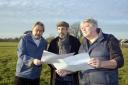 Martin Valatin (centre) with Cllr David Vigar (left) and Cllr Graham Hill (right) look at maps for the Roman remains on the Southwick Court Fields site.