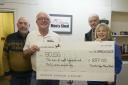 Members of the Trowbridge Mens Shed donate £687 for items sold at Weavers Market
Trowbridge Men's Shed members Richard Griffiths, Dennis Drewett and  Pat Johnson, hand over a cheque for £837  to Sue Oliver of BCUSG. Photo: Trevor Porter 69715-1
