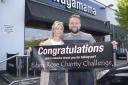 Harriet and Tom Robson  at the  end of  their charity challenge that has so far raised more than £13,500 .