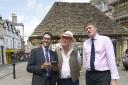 Terry  Bracher  Heritage Services Manager,  Phil Harding narrator  of Explore History App with Cllr Richard Clewer leader of Wiltshire Council,  at the launch of Explore History App at the Butter Cross and looking toward the  Angel Hotel