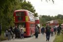 Visitors arrive at Imber on the classic London red buses