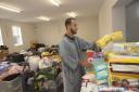 Ismail Negraj sorts donations at the Trowbridge Mosque to help fellow Moroccans in the earthquake disaster area.