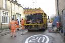 Contractors paint yellow lines on St Margaret’s Street as they prepare to open the much-delayed road over rail bridge in Bradford on Avon.