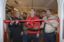 Former boxing champion Nick Blackwell, along with Bradford on Avon Mayor Katie Vigar, cut the tape to officially open the River Spice Indian Restaurant with the five brothers who comprise the Rahman family.