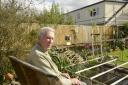 Derek Peters enjoys sitting on his garden seat to watch his pond but is now overlooked by the huge loft conversion.