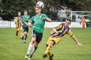 Dan Kovac's (green shirt) move forward is shut down by the Ashton and Backwell United defence