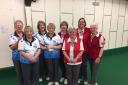 Clarrie Dunbar (blue) and North Wilts (red) players line up ahead of their Mason Trophy match. Pictured are (from left) Jeanette Wheeler, Ruth Jupp, Sue Bird, Pam Trippitt, Sue Cooke, Margaret Cook, Bev Lilley, Jean Collier.