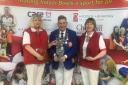 North Wilts players Alex Jacobs (left) and Sue Cooke with EIBA president Mark Cohen after their victory in the national O60 ladies pairs final