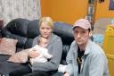 Chris McEvoy, wife Antje and three-month-old Ciara in their cramped and damp flat