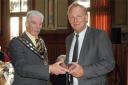 Trowbridge mayor John Knight presents an official gift to the people of Leer