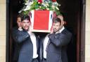 Former colleagues of Mr Henderson carry his coffin (Ben Birchall/PA)